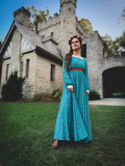 Woman in modest nursing blue dress at building