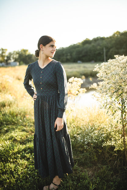 Woman in modest nursing dress outdoors sunlight
