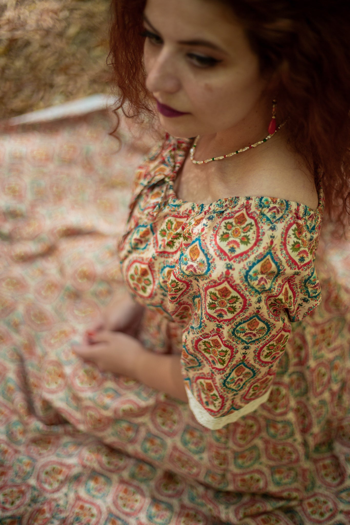 Woman wearing a patterned modest nursing dress