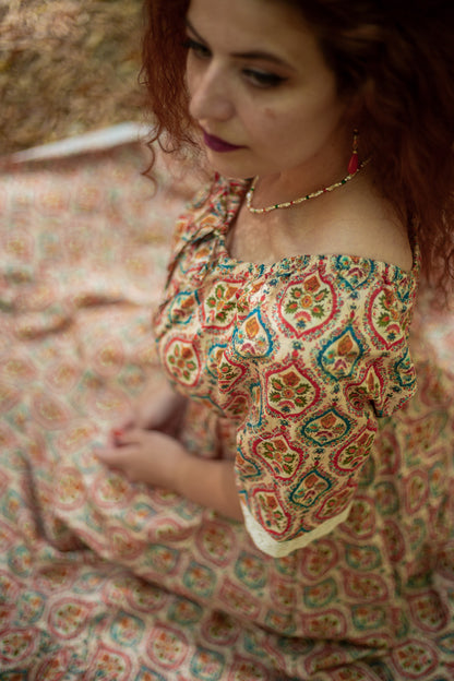 Woman wearing a patterned modest nursing dress
