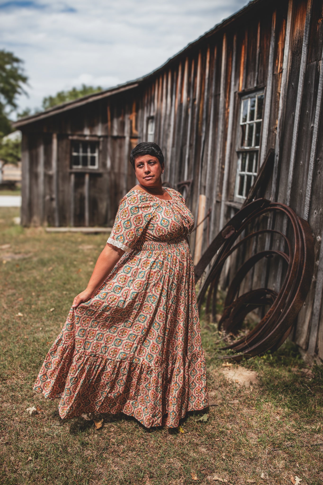 Woman wearing a patterned modest nursing dress