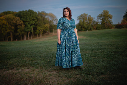 Woman in modest nursing dress in field