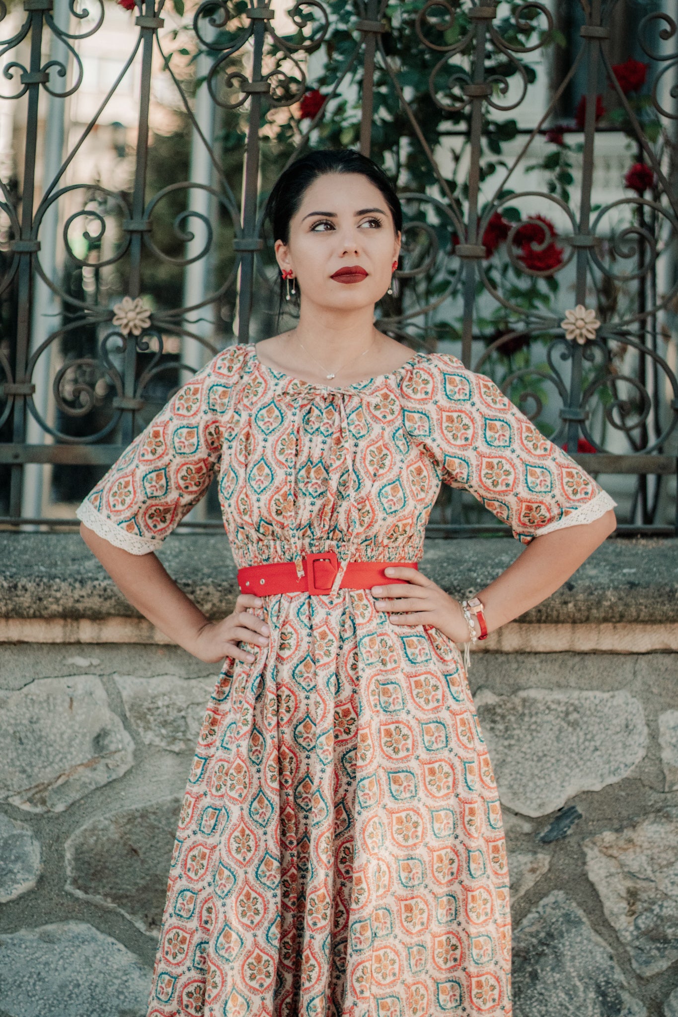 Woman wearing a patterned modest nursing dress