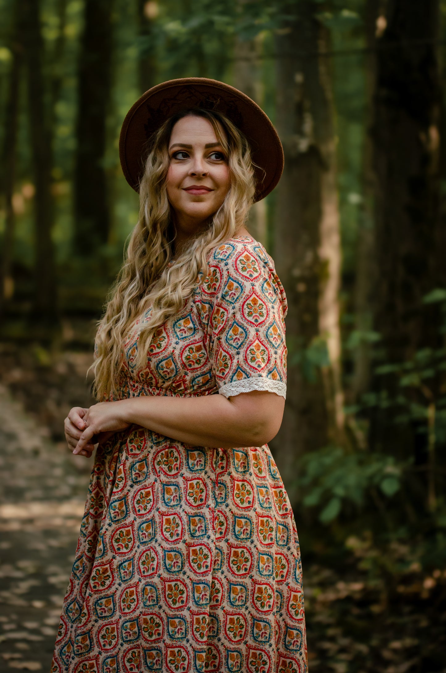 Woman wearing a patterned modest nursing dress