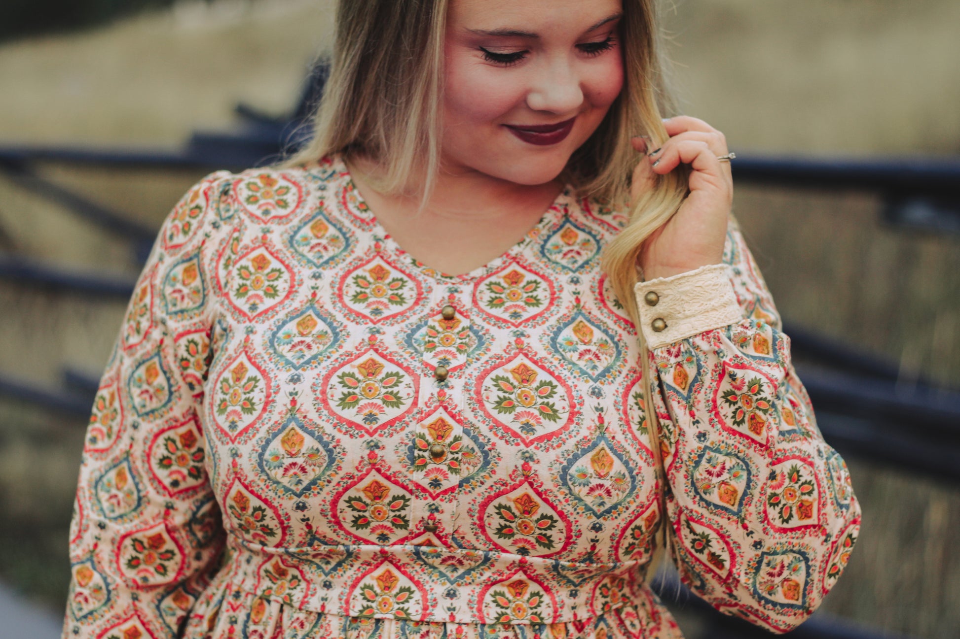 Woman wearing a patterned modest nursing dress