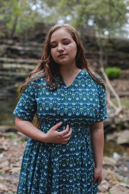 Woman in modest nursing dress outdoors