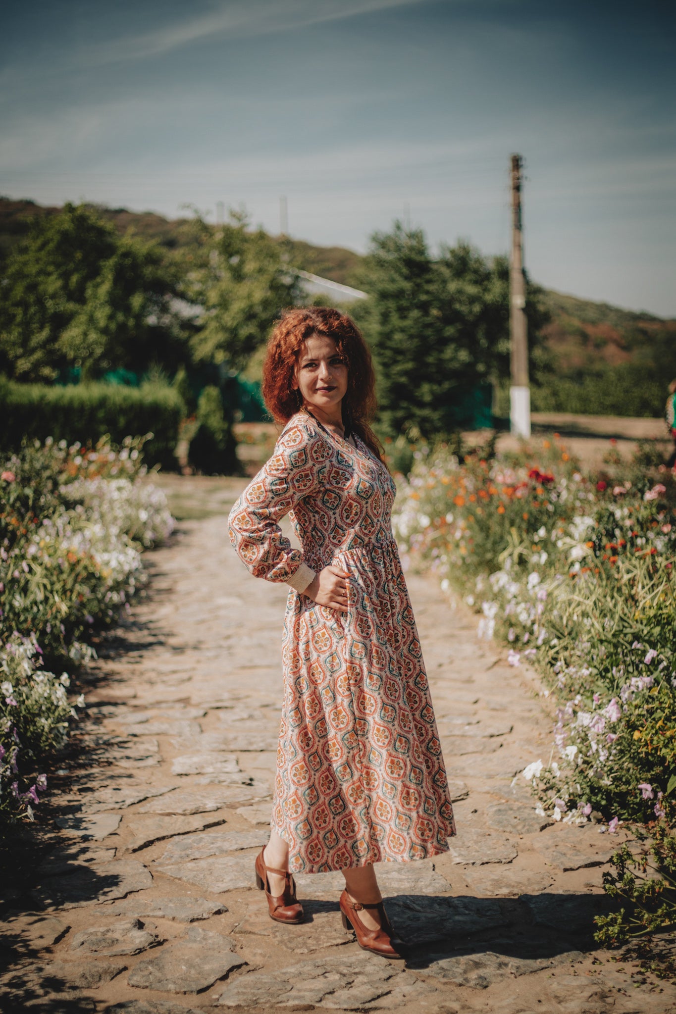 Woman wearing a patterned modest nursing dress