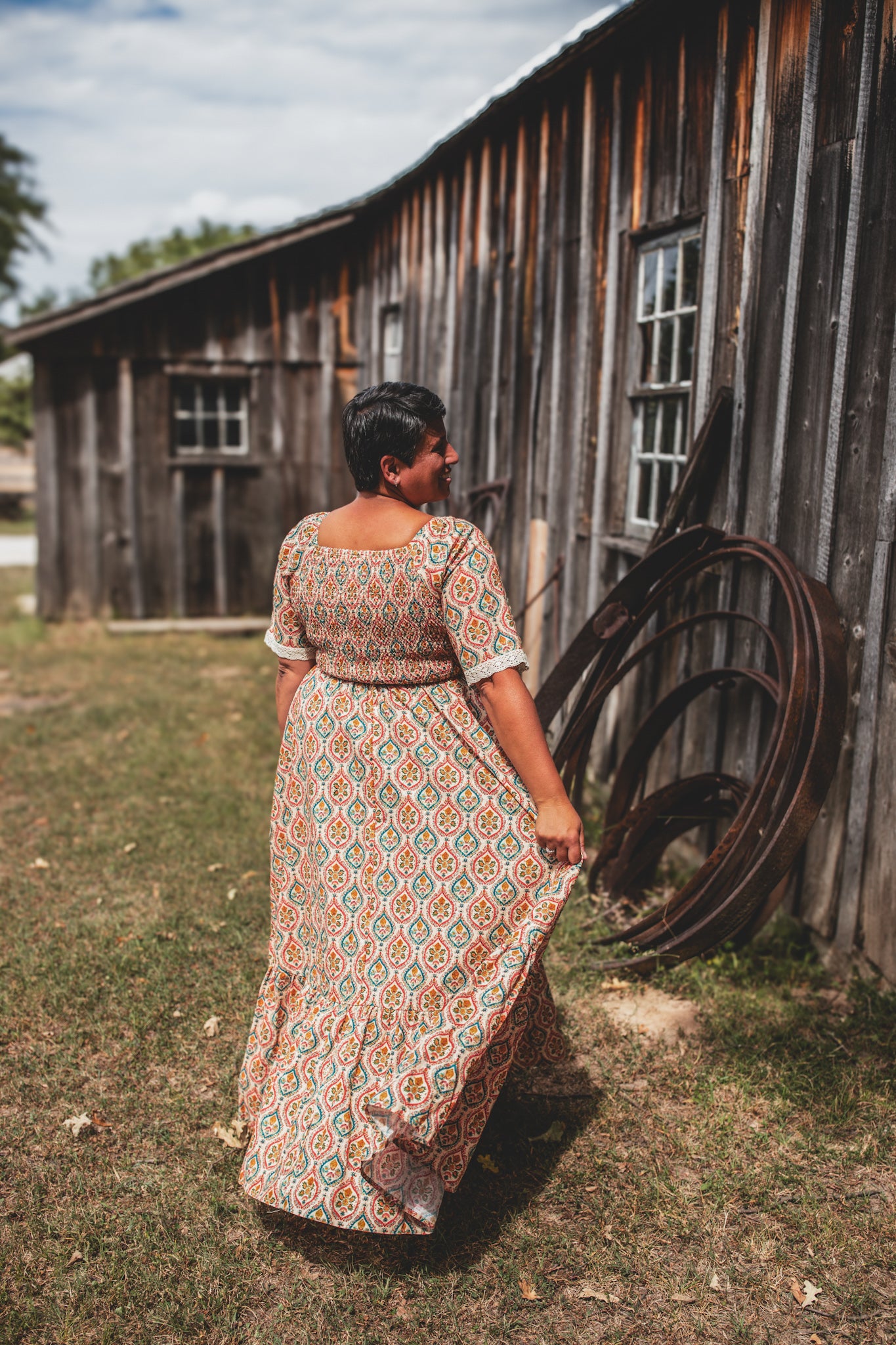 Woman wearing a patterned modest nursing dress