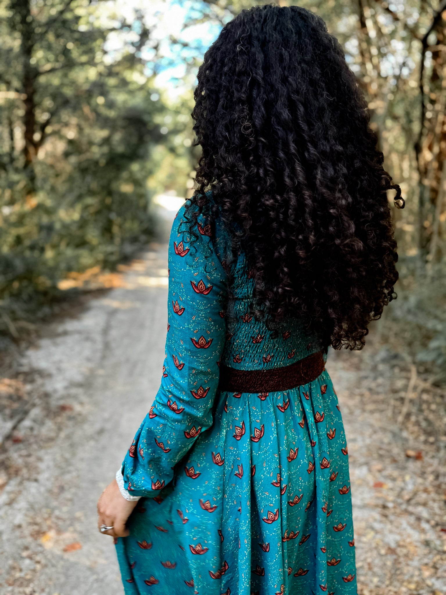 Woman in modest nursing blue patterned dress