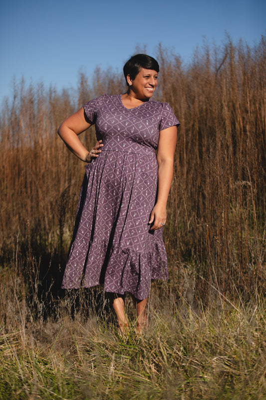 Modest nursing friendly purple dress in field