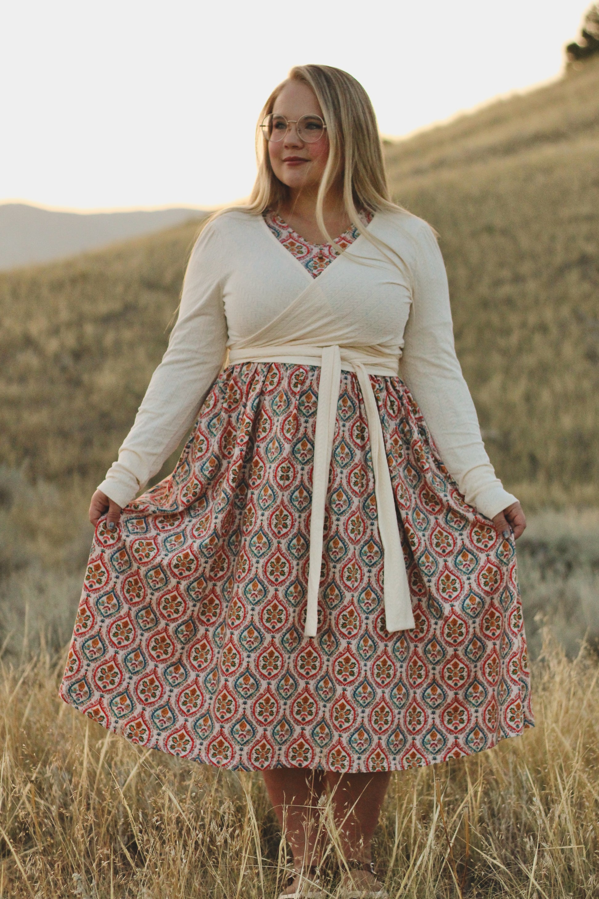 Woman wearing a patterned modest nursing dress