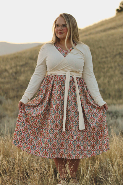 Woman wearing a patterned modest nursing dress