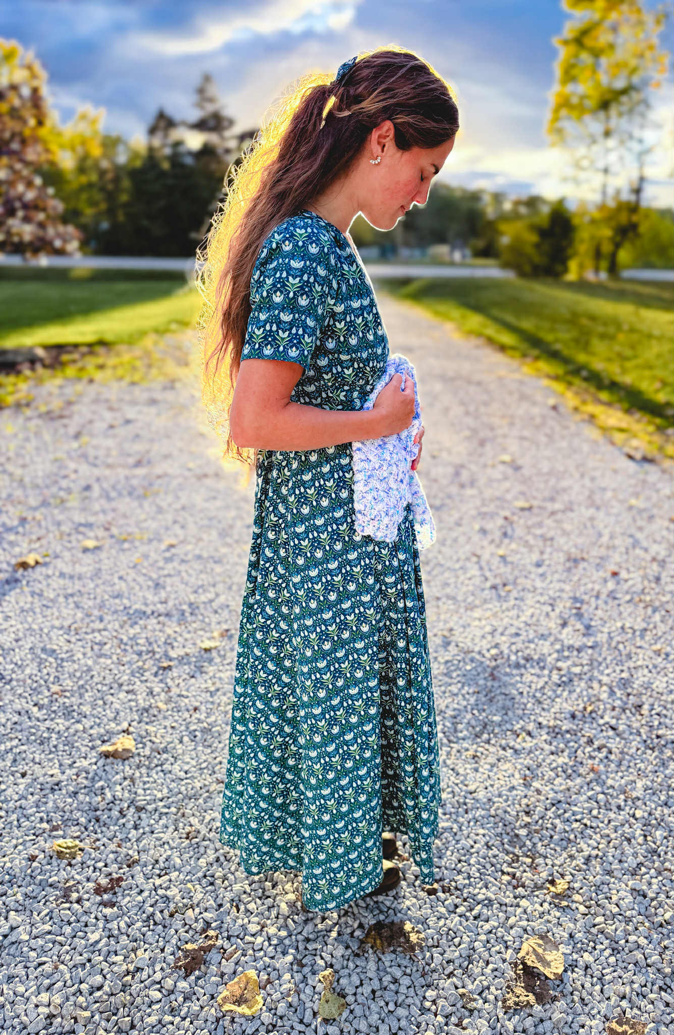 Woman in modest nursing dress outdoors