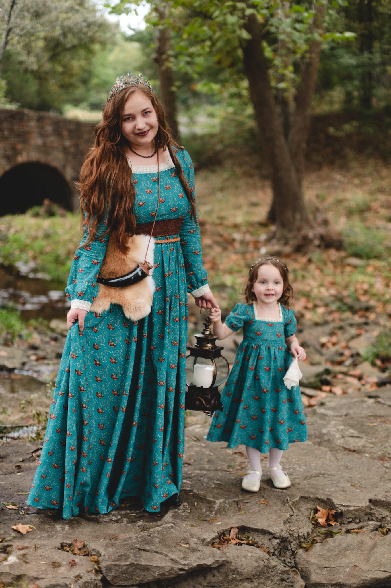 Two women wearing modest nursing dresses outdoors together.