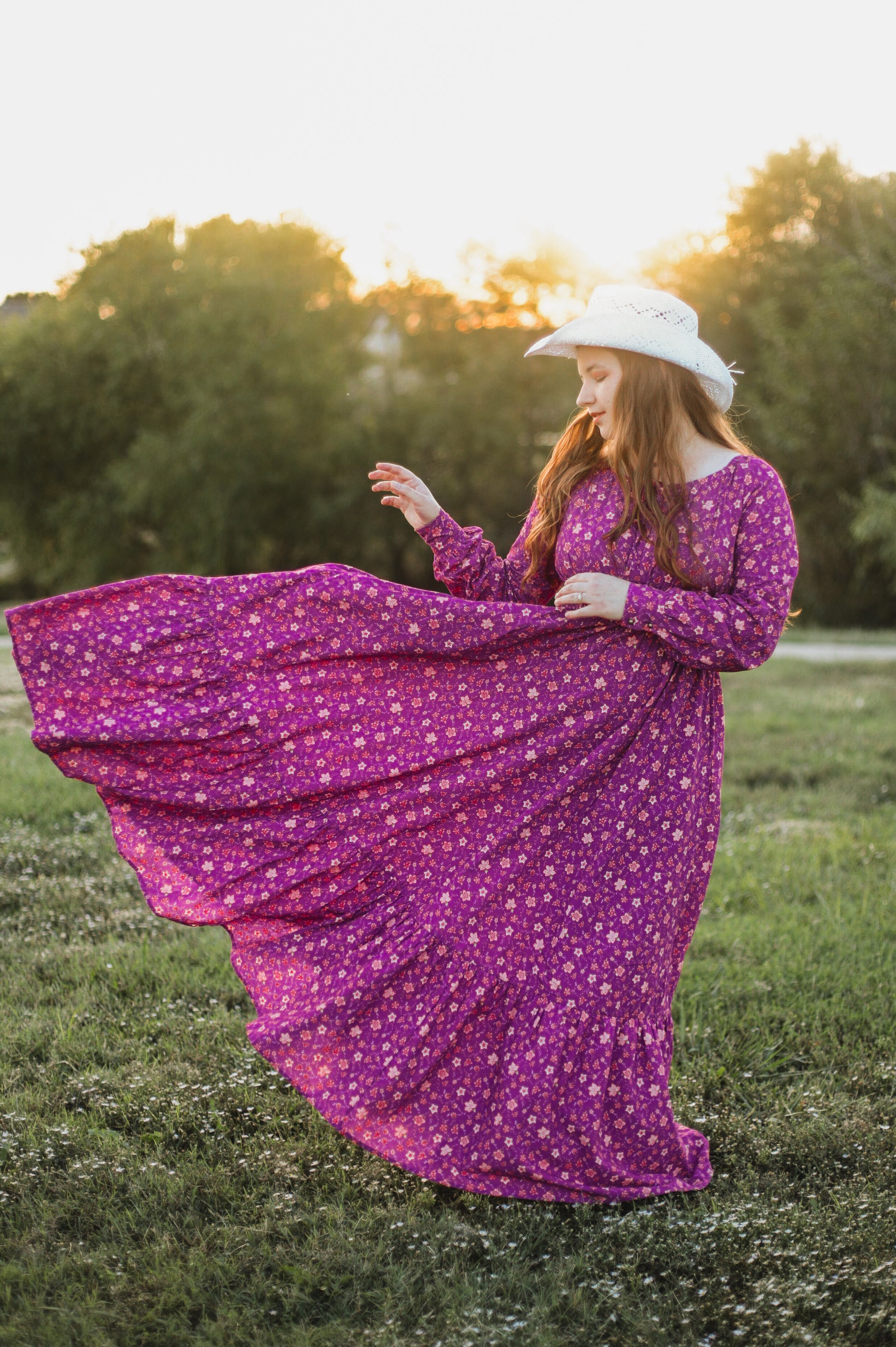 Woman in modest purple floral nursing dress