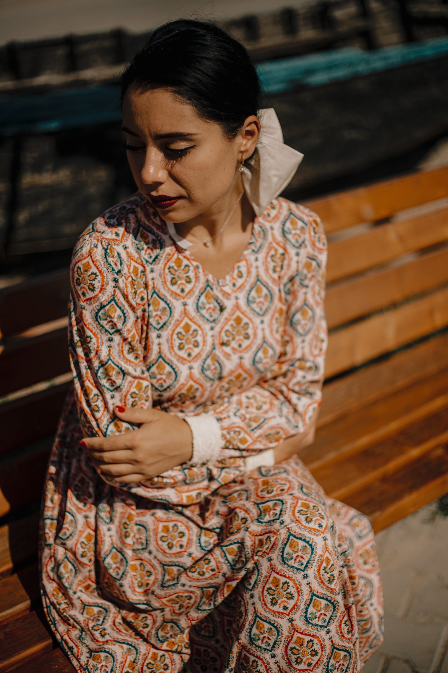 Woman wearing a patterned modest nursing dress