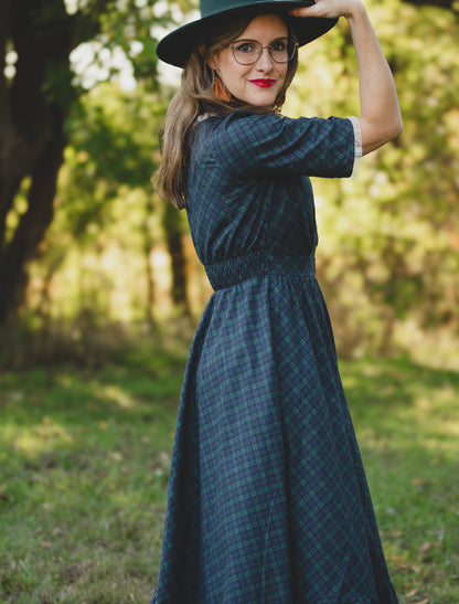 woman wearing a modest nursing blue patterned dress