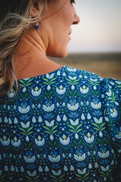 Woman in modest nursing dress with natural background