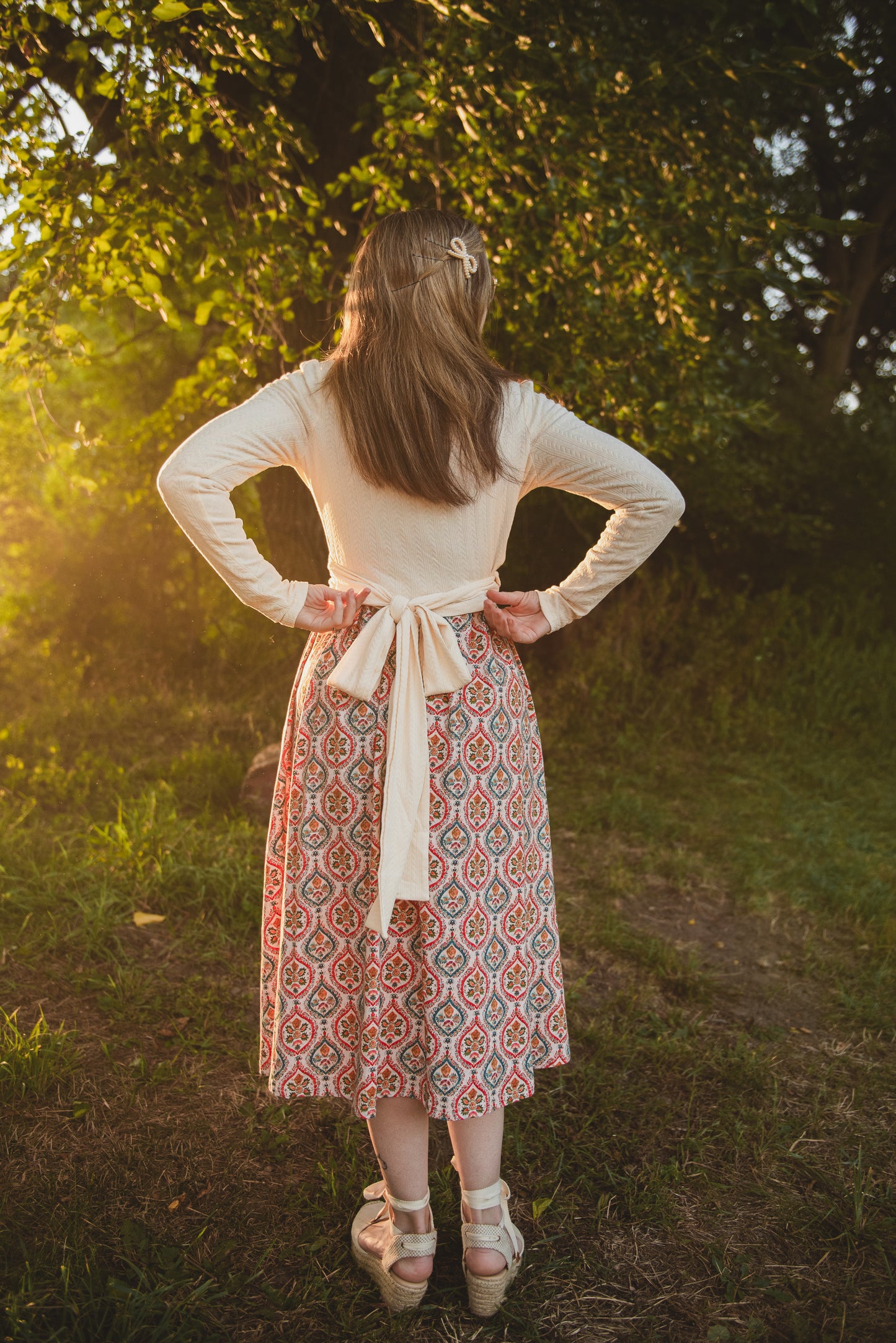 Woman wearing a patterned modest nursing dress