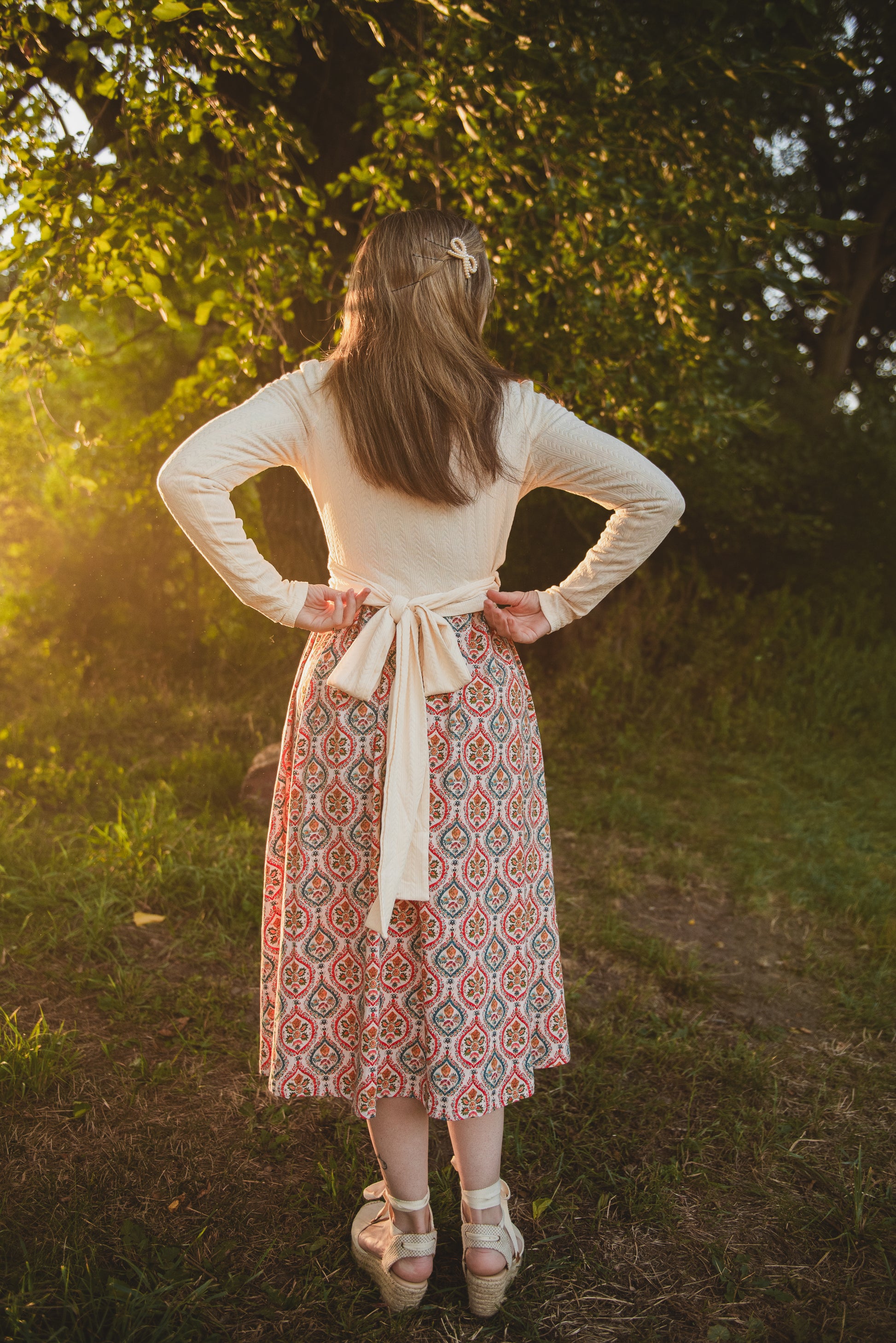 Woman wearing a patterned modest nursing dress
