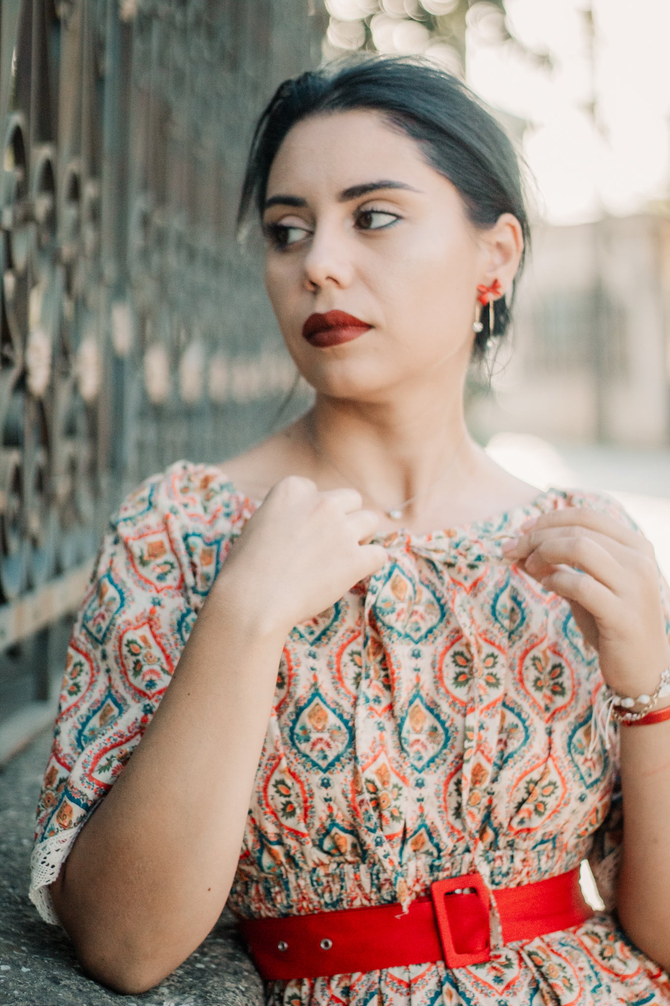 Woman wearing a patterned modest nursing dress