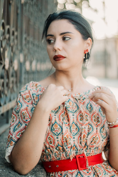 Woman wearing a patterned modest nursing dress