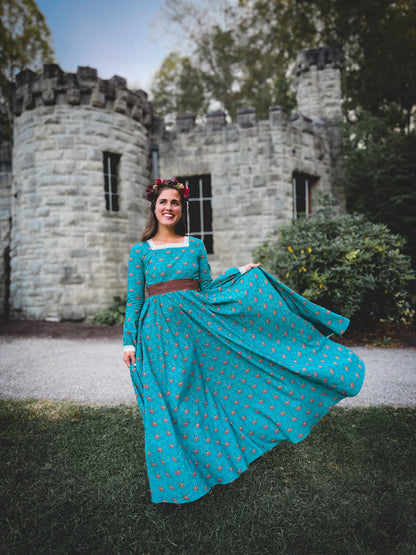 Woman in modest nursing blue dress at castle
