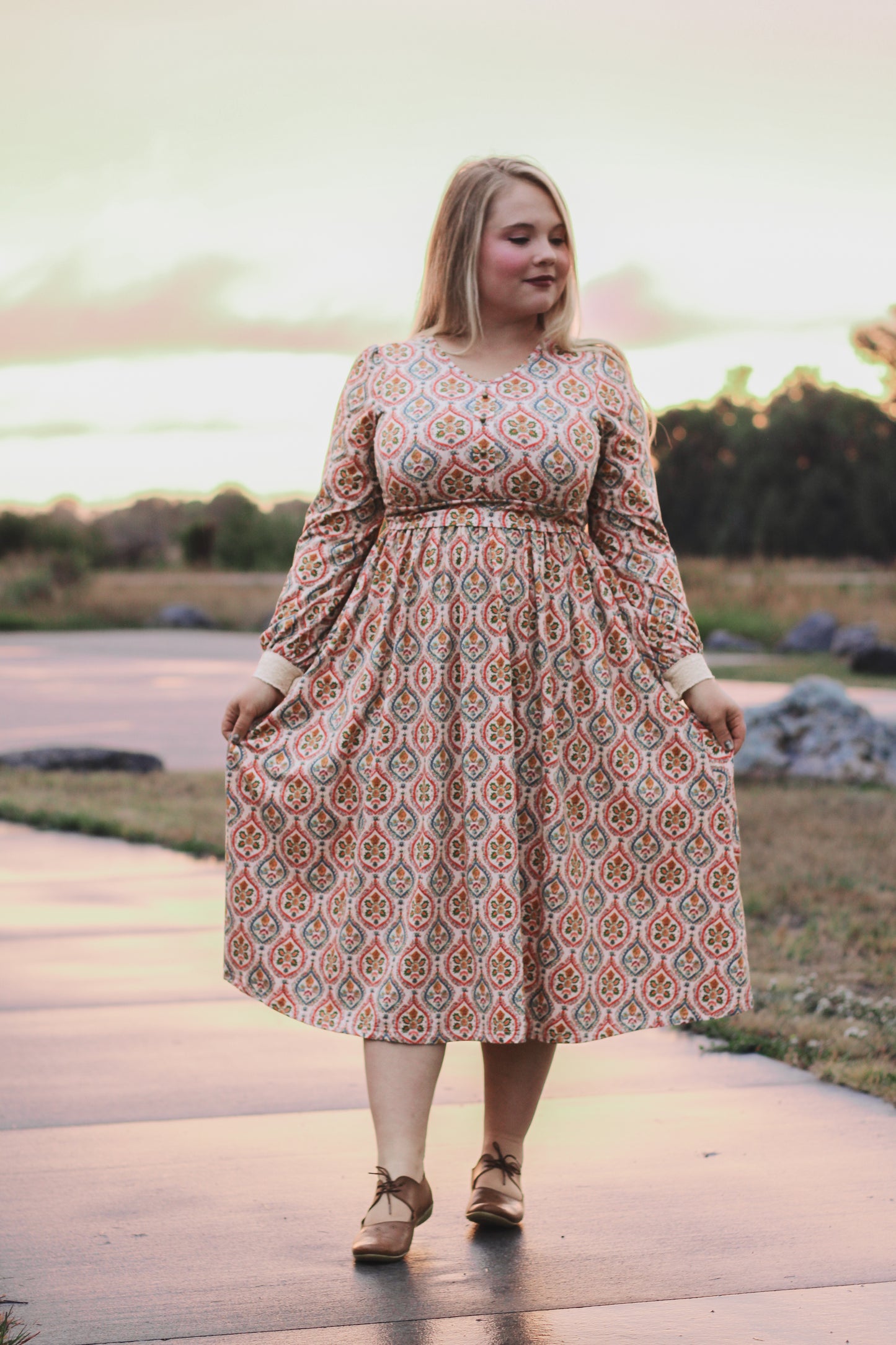 Woman wearing a patterned modest nursing dress