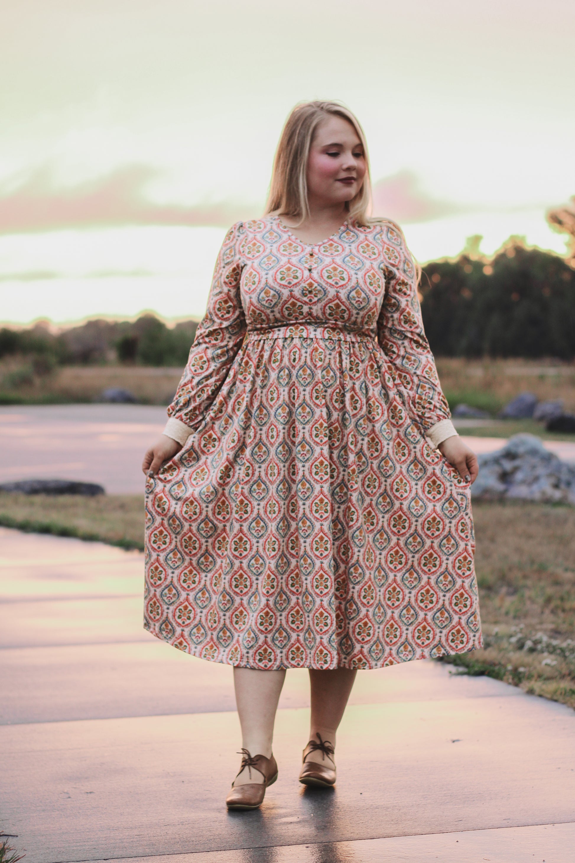 Woman wearing a patterned modest nursing dress