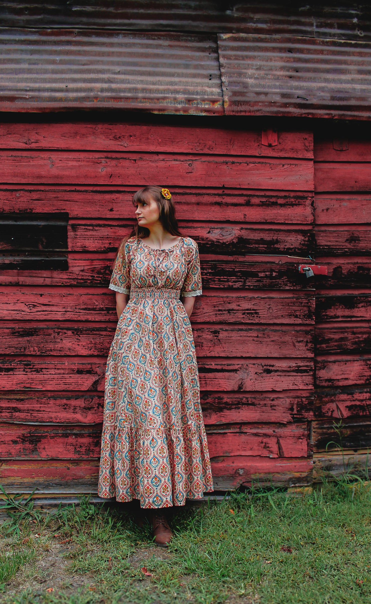 Woman wearing a patterned modest nursing dress