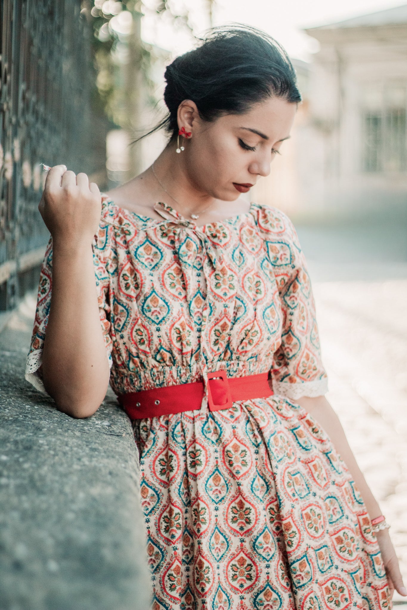 Woman wearing a patterned modest nursing dress