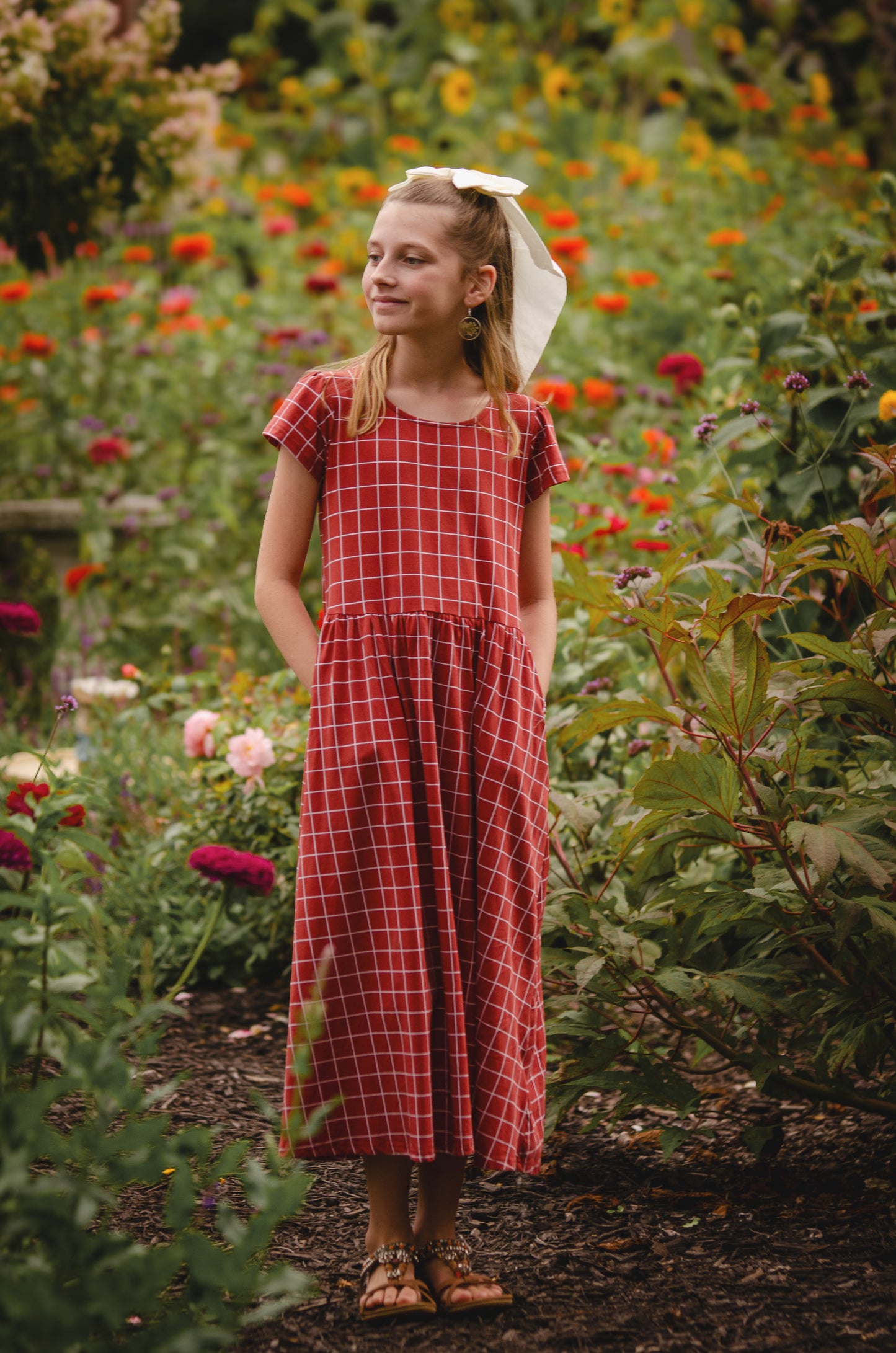 Girl in modest checkered dress, ready for nursing.
