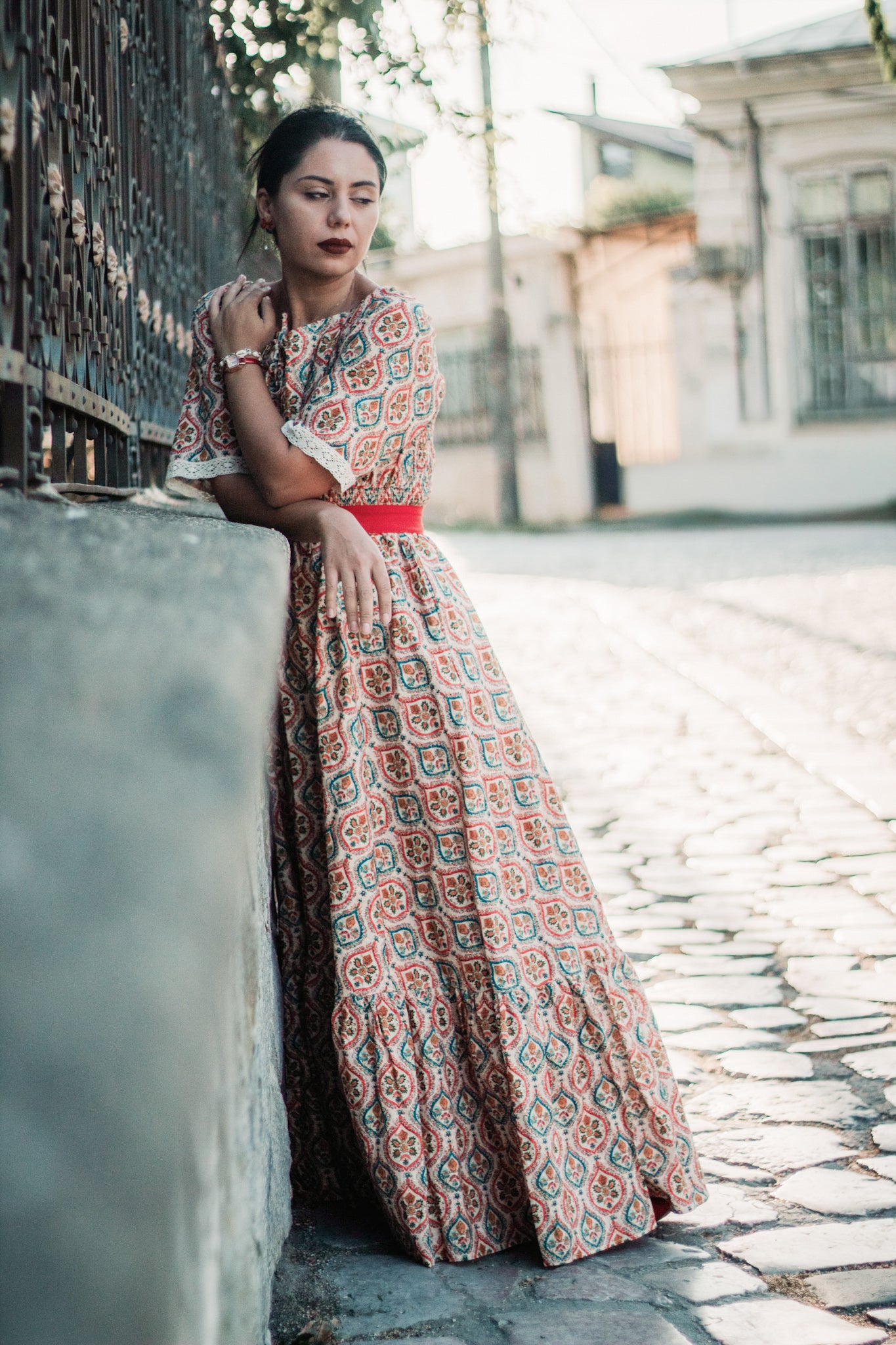 Woman wearing a patterned modest nursing dress