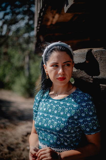 Woman in modest nursing dress, blue pattern closeup.