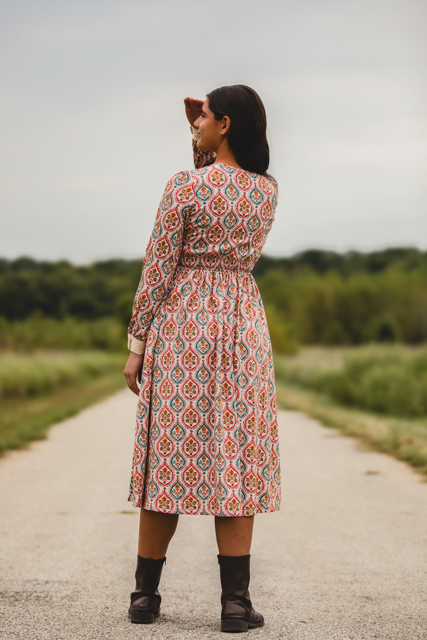 Woman wearing a patterned modest nursing dress