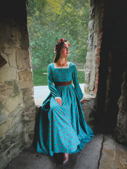 Woman in modest nursing blue dress in archway