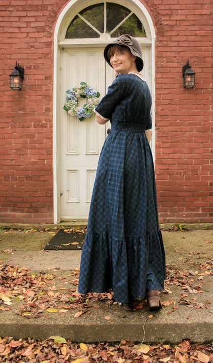 woman wearing a modest nursing blue patterned dress