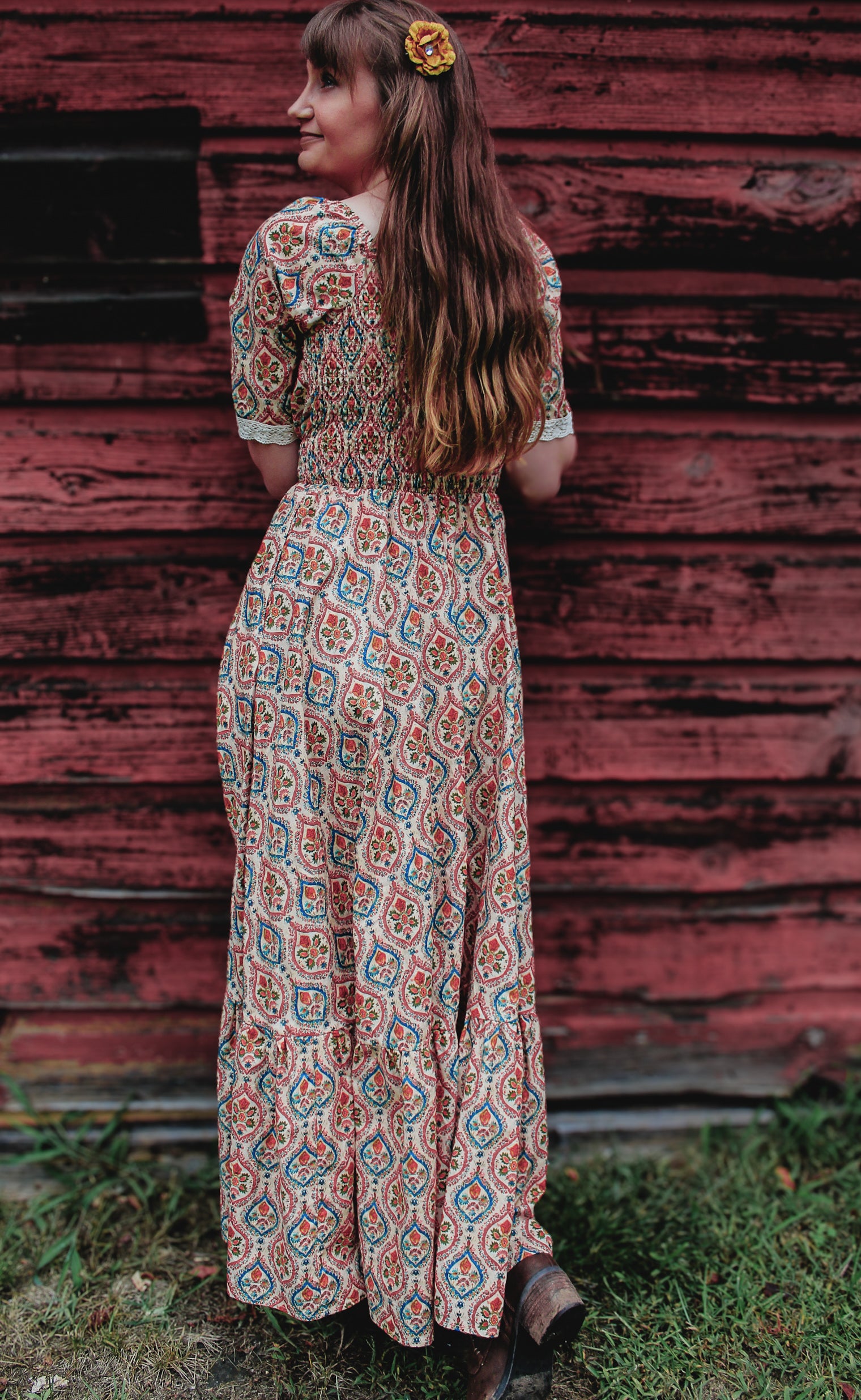 Woman wearing a patterned modest nursing dress