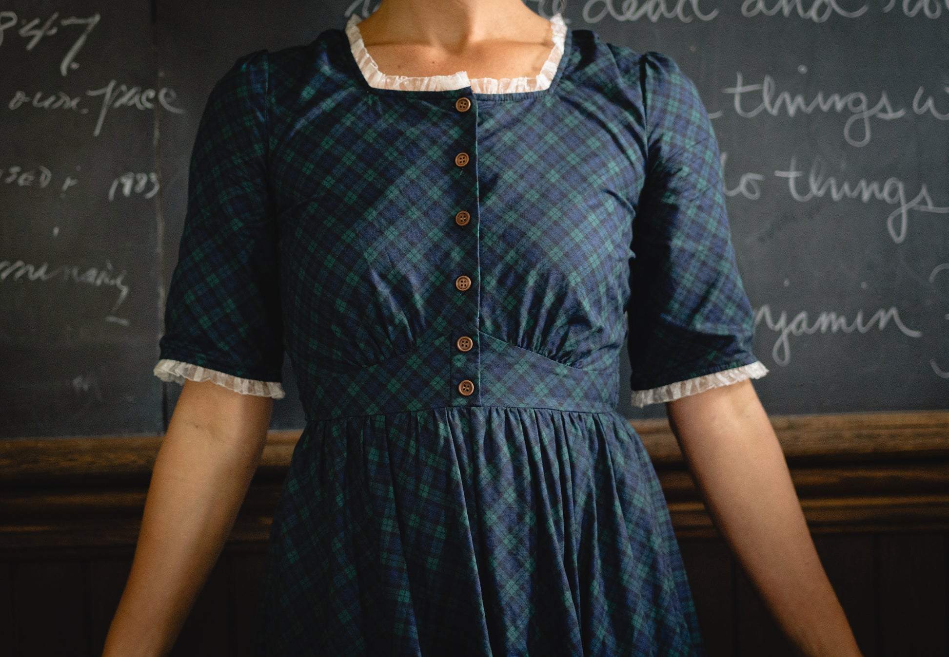 woman wearing a modest nursing blue patterned dress