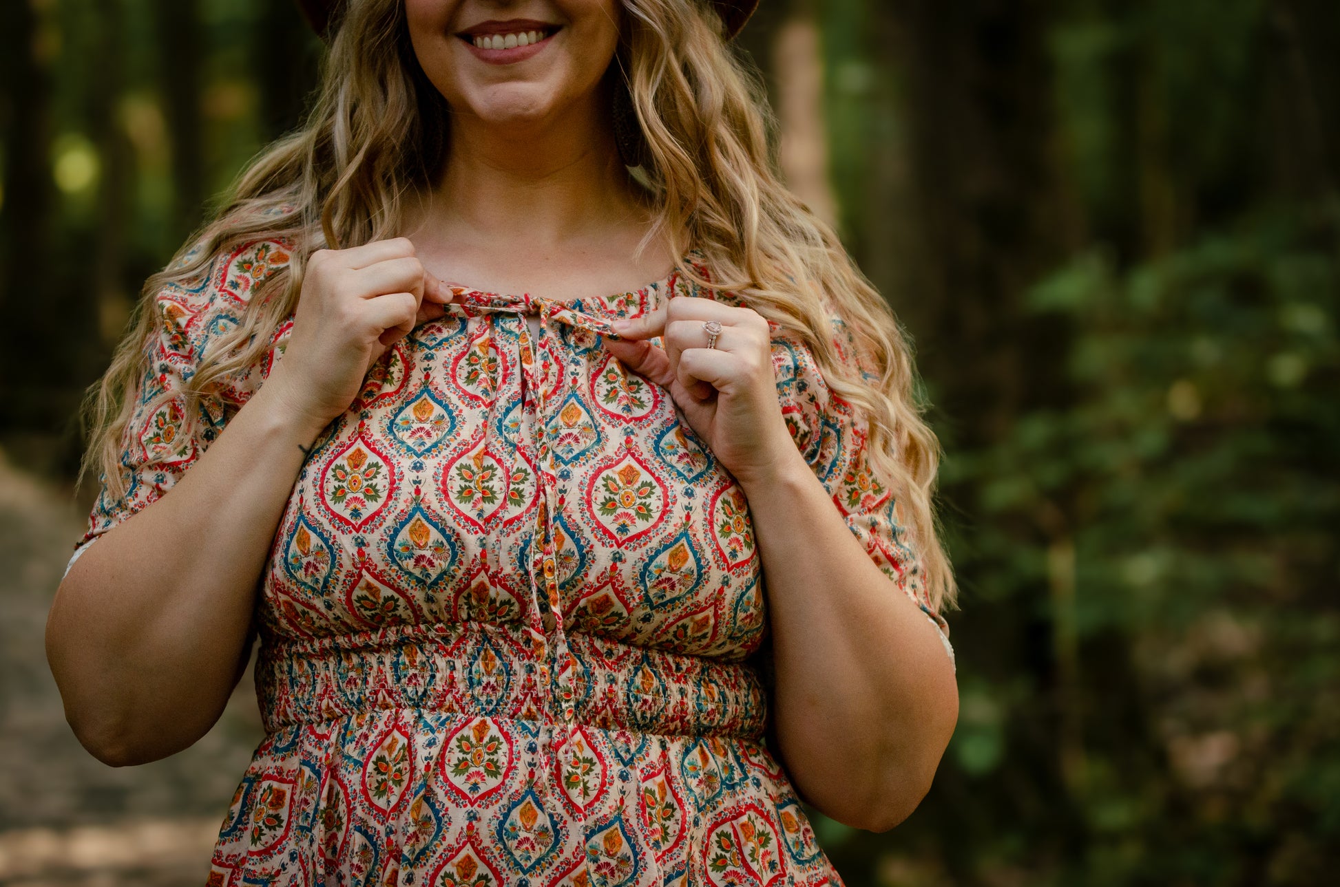 Woman wearing a patterned modest nursing dress