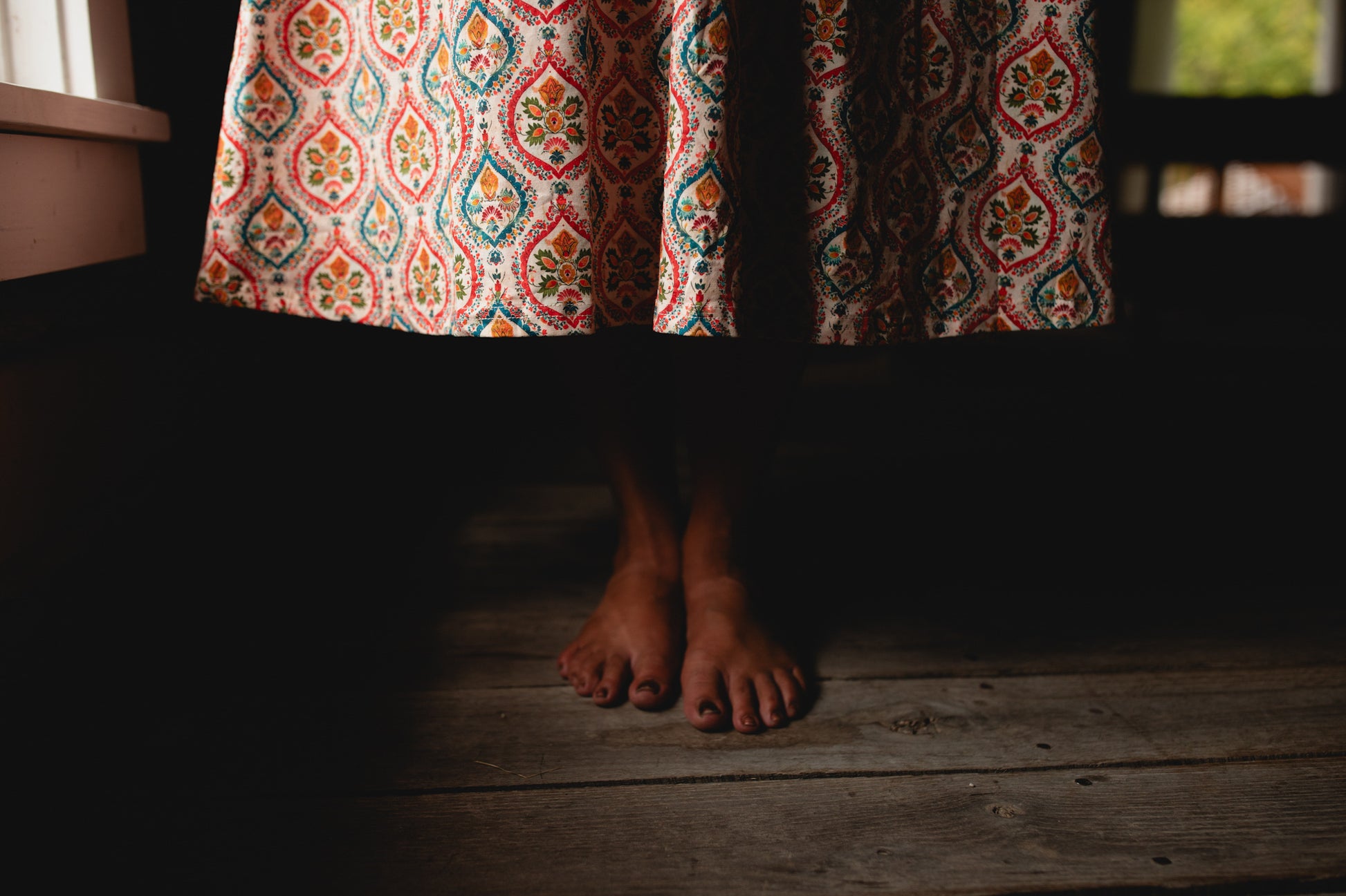 Woman wearing a patterned modest nursing dress