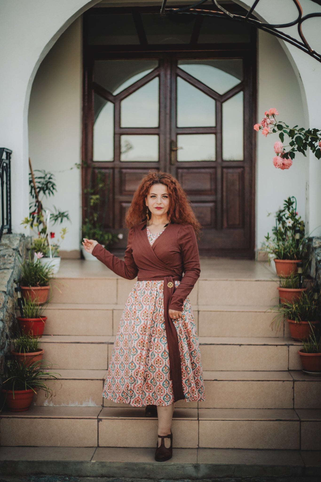 Woman wearing a patterned modest nursing dress