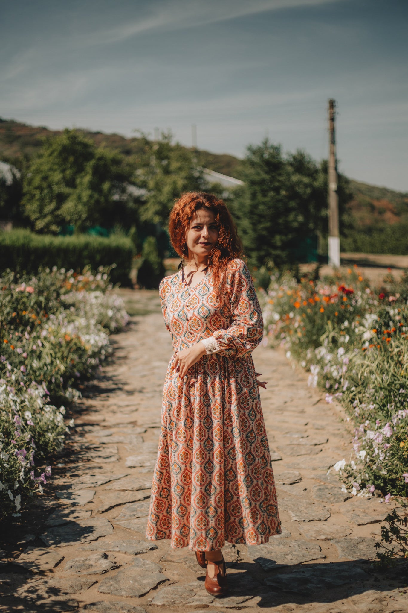 Woman wearing a patterned modest nursing dress