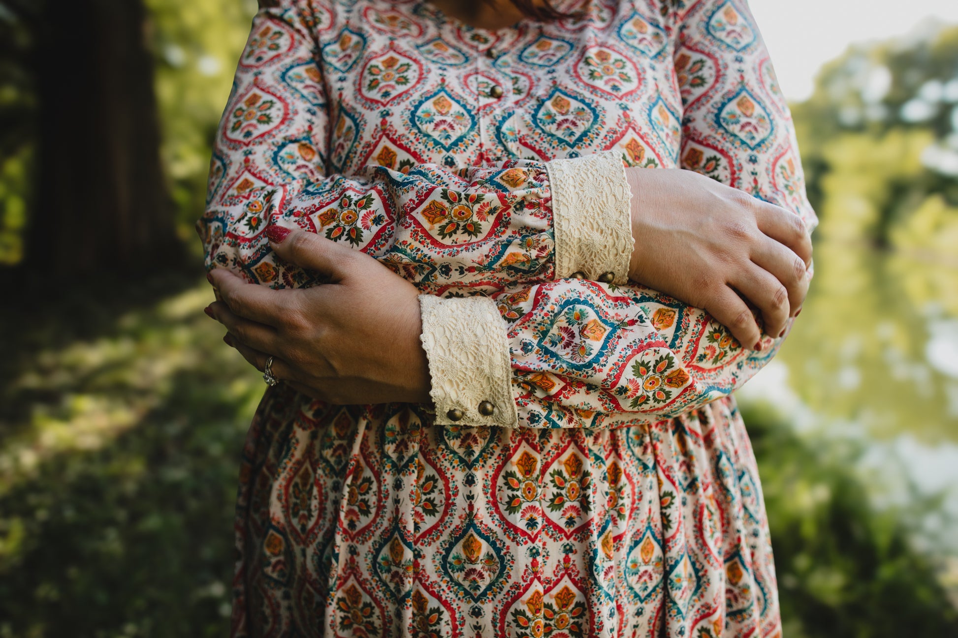 Woman wearing a patterned modest nursing dress
