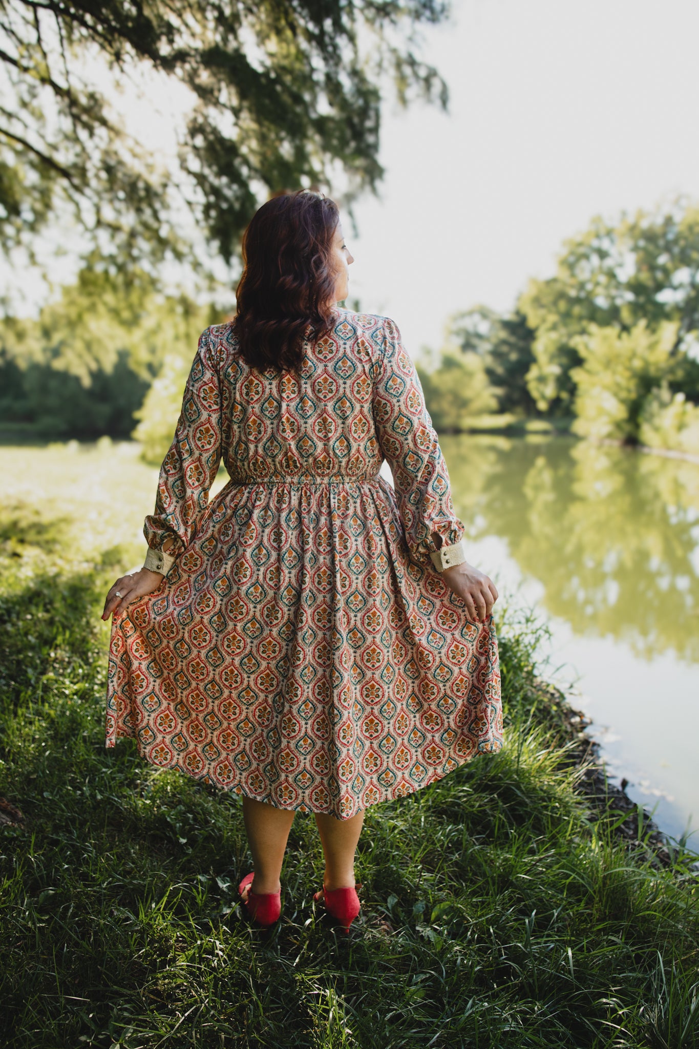 Woman wearing a patterned modest nursing dress