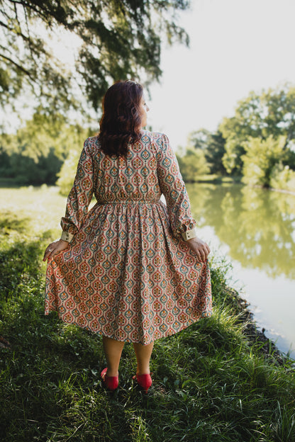 Woman wearing a patterned modest nursing dress