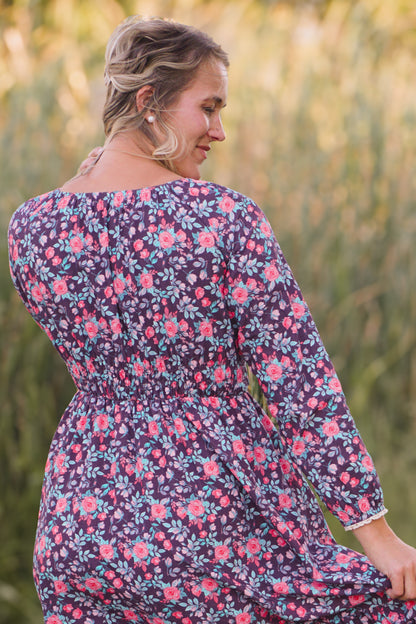 Woman in modest nursing floral dress outdoors