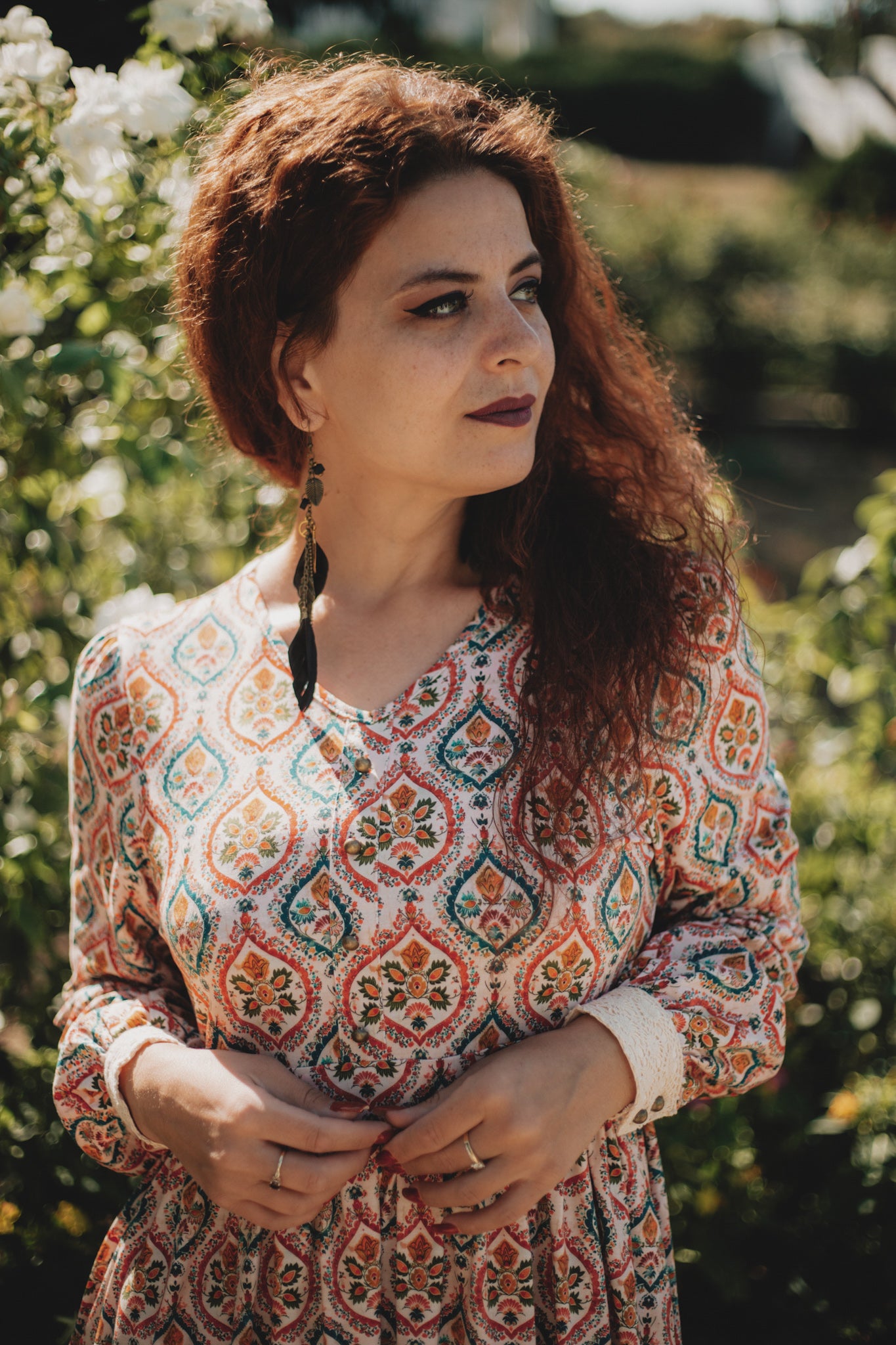 Woman wearing a patterned modest nursing dress
