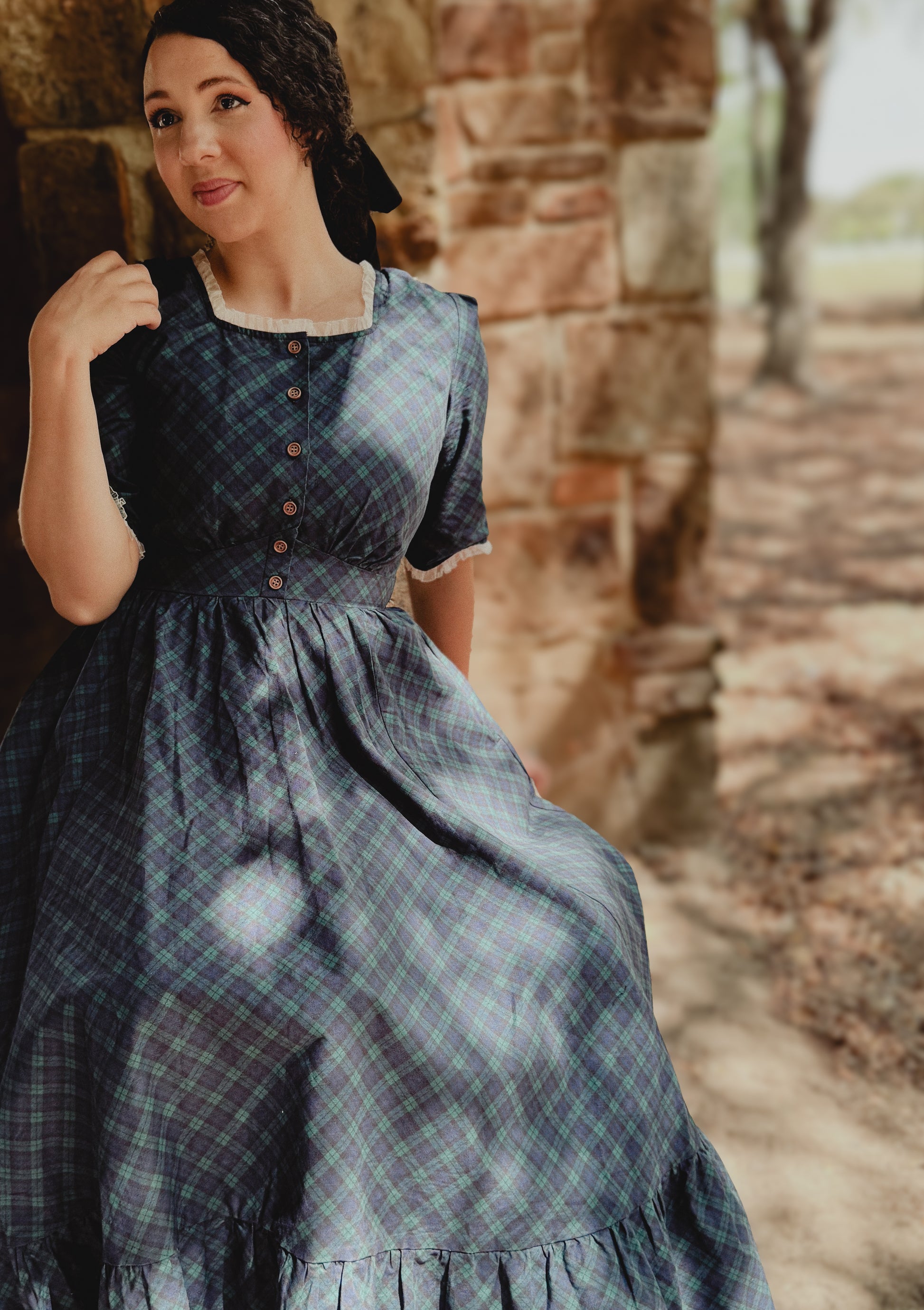 woman wearing a modest nursing blue patterned dress