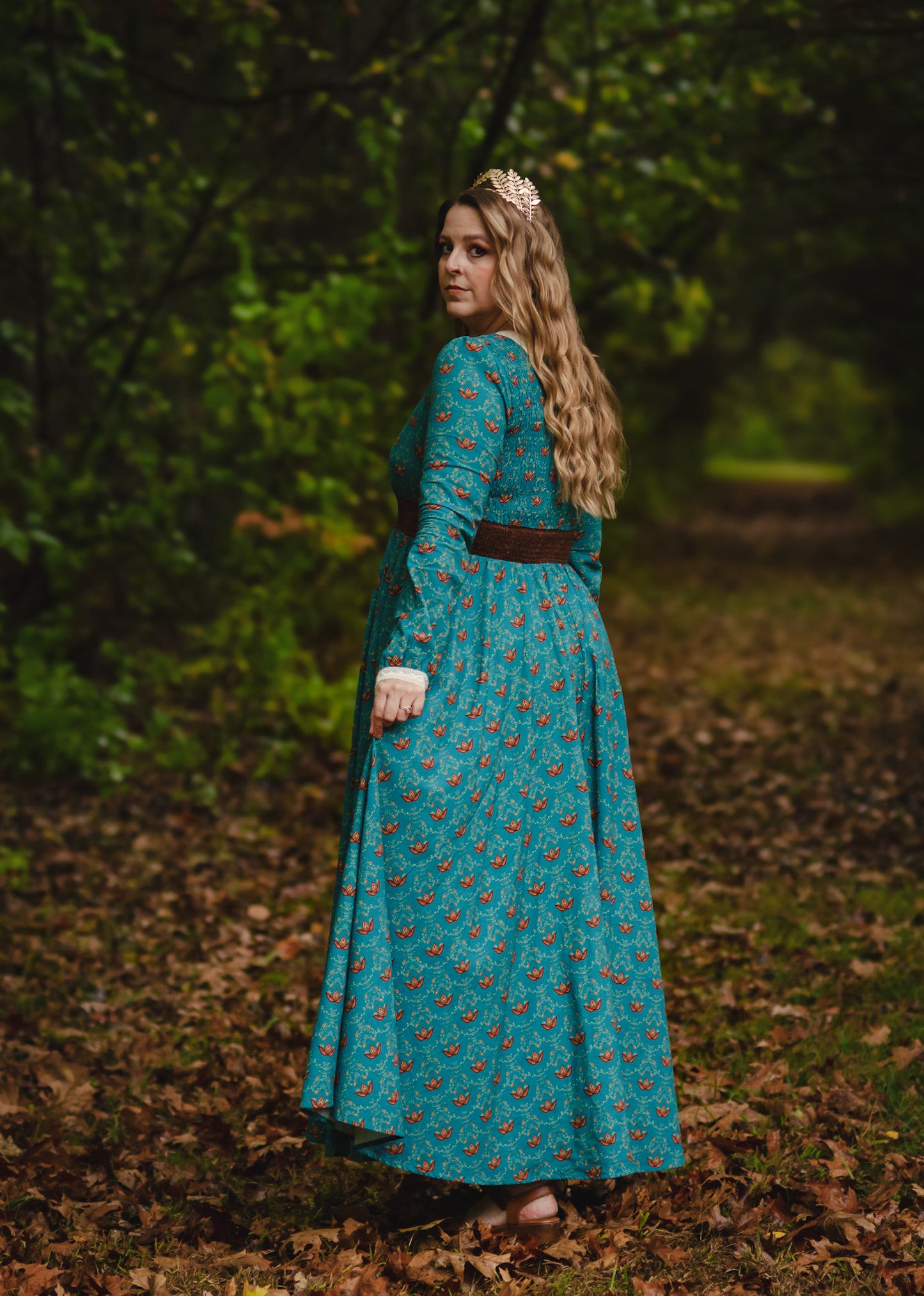 Woman in modest nursing teal floral dress